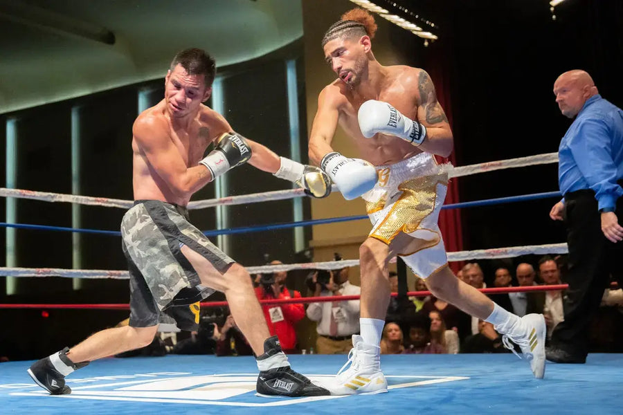Two boxers boxing in a ring