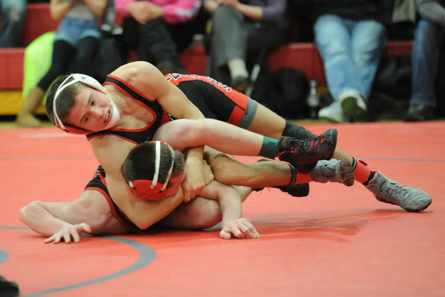 Two wrestlers with braces with goon guard mouthguards